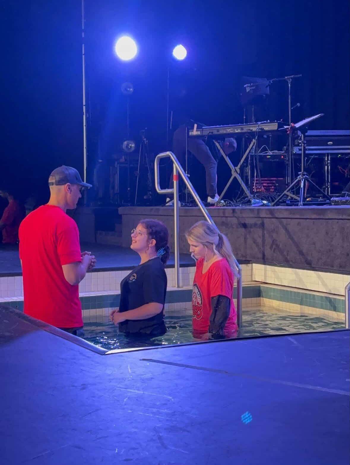 An outdoor baptism at night
